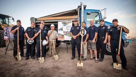 First responders hold shovels in celebration of the new park. 